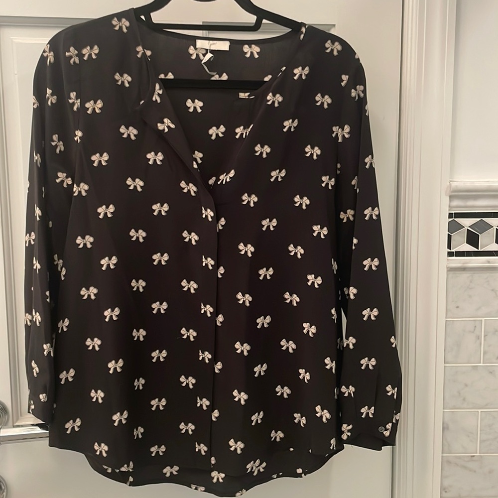 Joie small black with white bow blouse. Hidden button down front serial